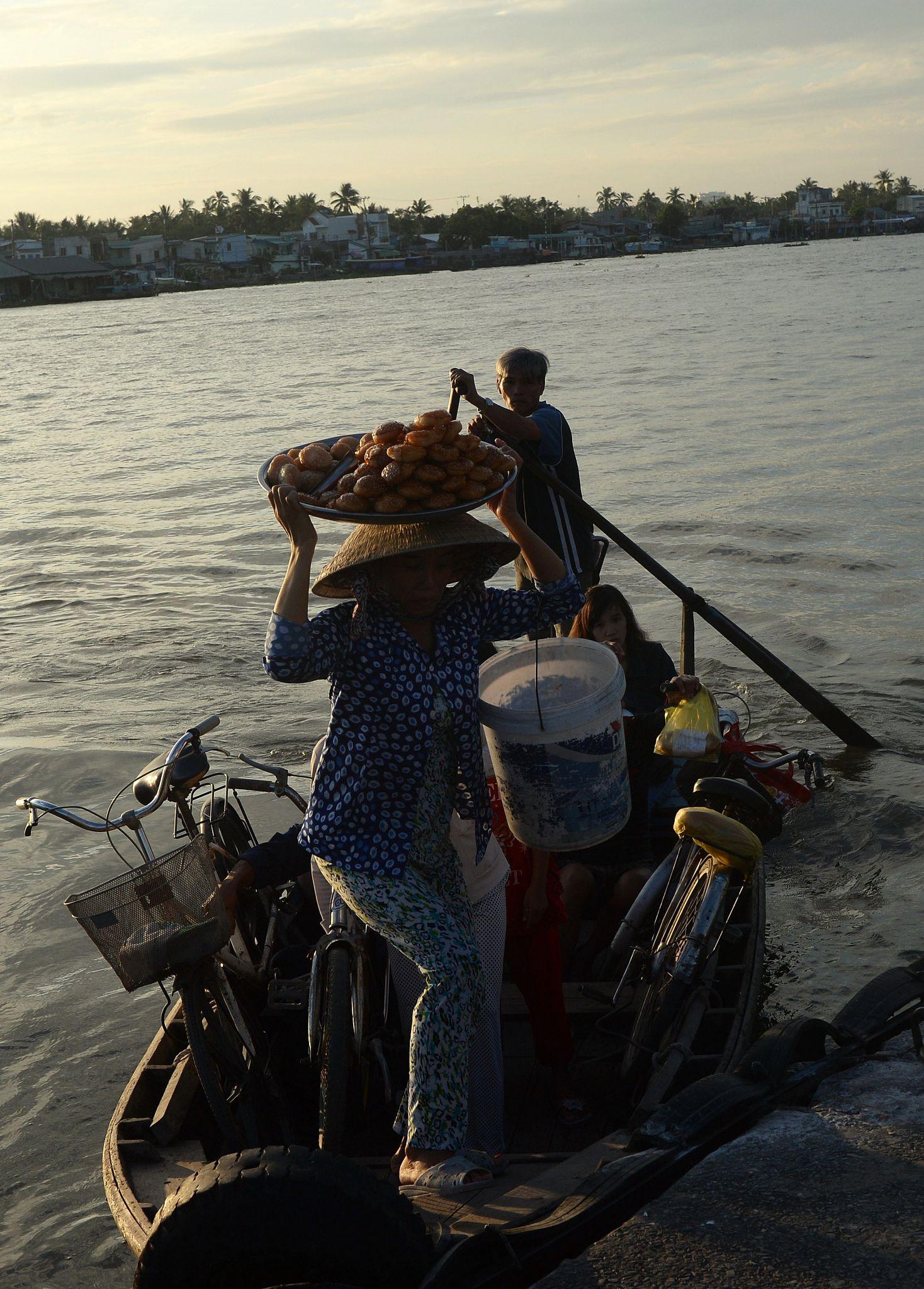 Mekong Delta family on boat Vietnam